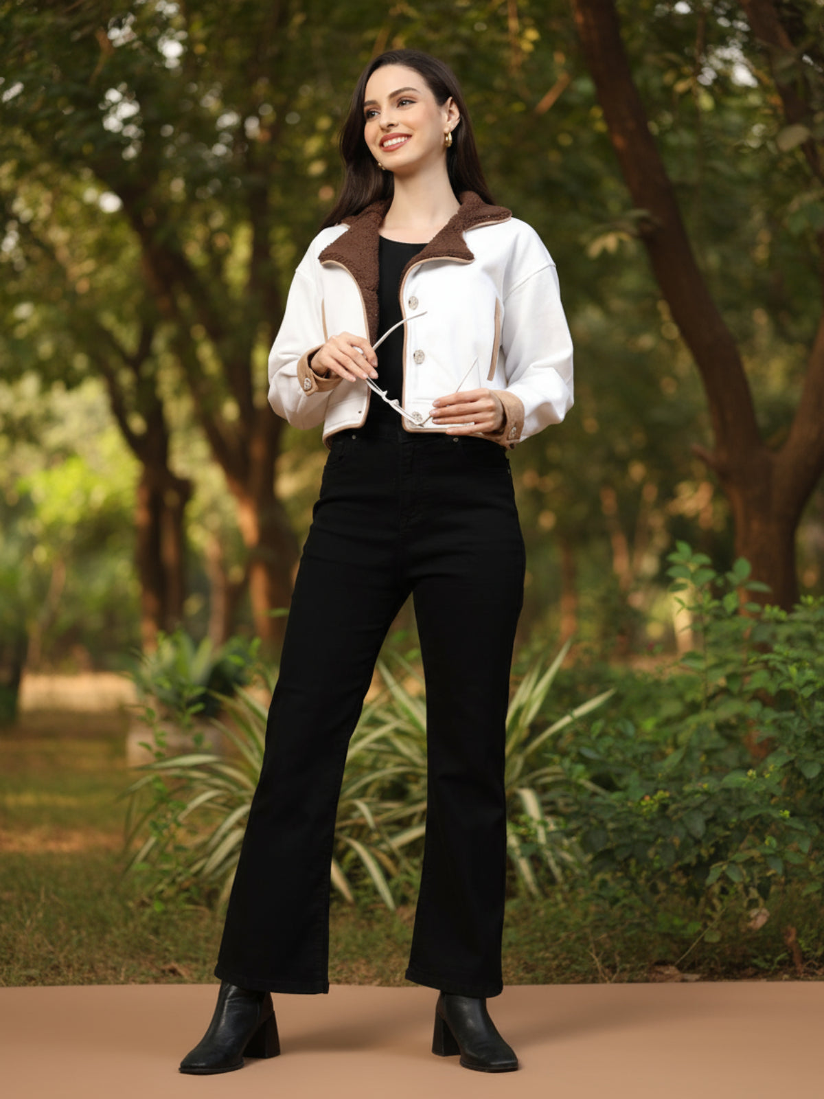 Woman walking on a neon-lit city street at night